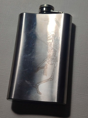 Metal flask used with laser graphics