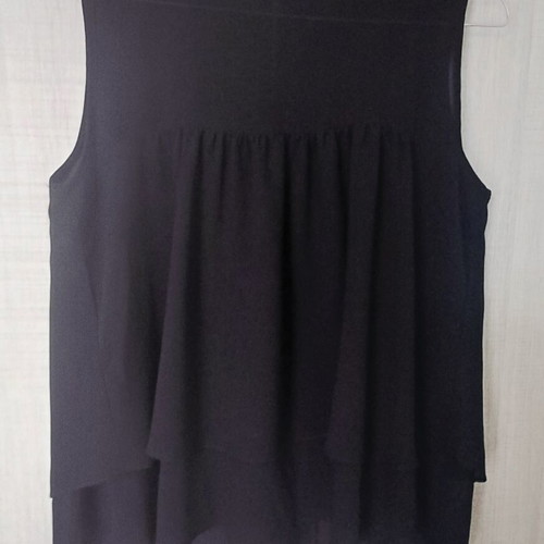 Sleeveless women's blouse black like new with ruffles and sheer detail