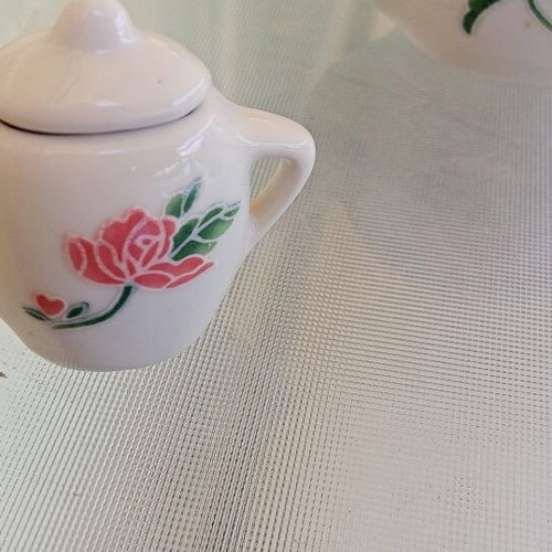 Vintage porcelain miniature tea set with roses and cutlery, like new
