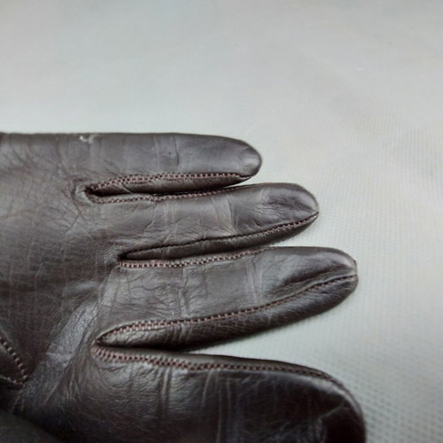 Women's dark brown leather gloves used