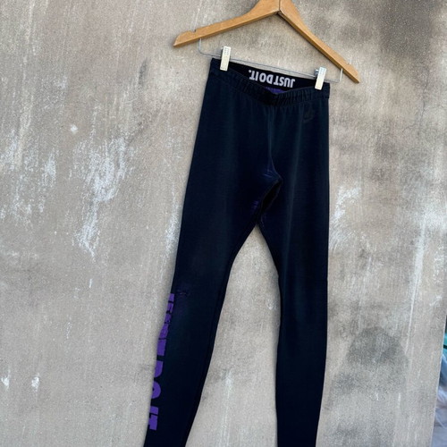 Nike legging used with knee defect, black and purple, size S