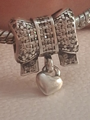Pandora Charm bow with dangling heart pave zirconia like new