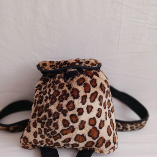 Small fluffy backpack like new, brown