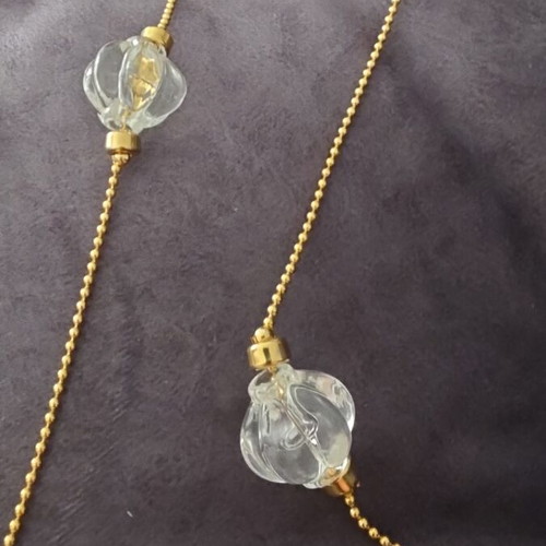 Faux necklace with long gold-coloured chain