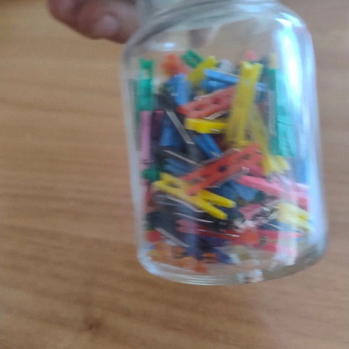 Storage jar with small clothespins for crafts