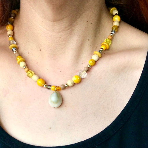 Necklace with shell and yellow beads