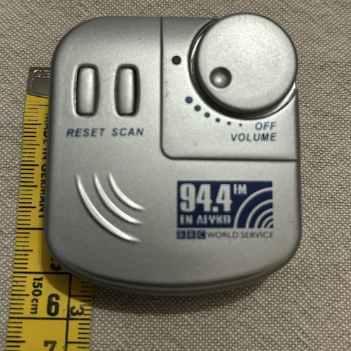 Pocket Radio with Headphones like new, silver color