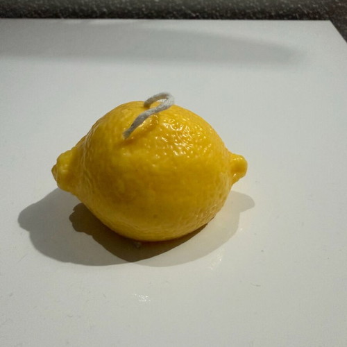 Handmade lemon-shaped candle with lemon scent new