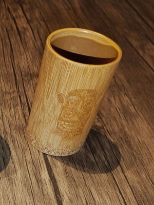 Bamboo glass with decorative symbol, unused