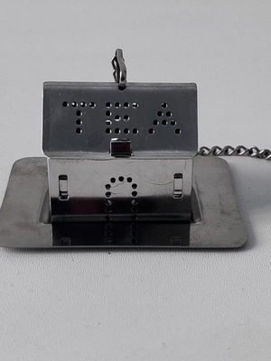 Vintage stainless steel tea infuser house with base and chain like new
