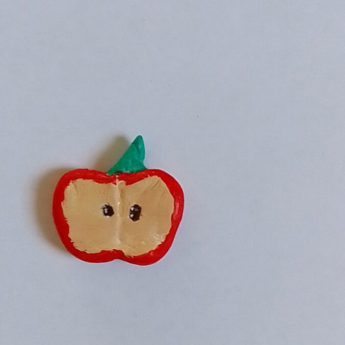 Handmade apple magnet from clay
