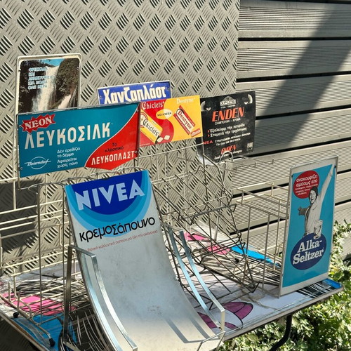 Retro kiosk stand used with authentic vintage advertisements