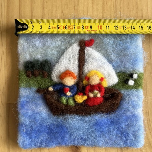 Handmade wool felt wall art with sailing boat and children