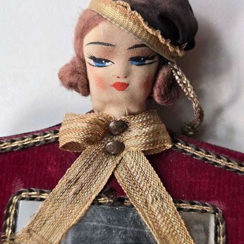Antique mirror with velvet frame and doll, used 1950-1965