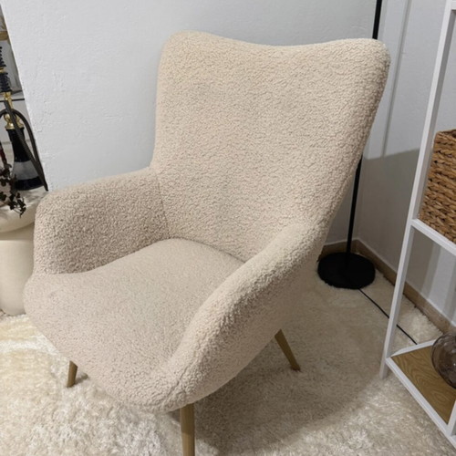 Armchair used, off-white fuzzy with steel legs