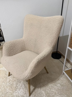 Armchair used, off-white fuzzy with steel legs