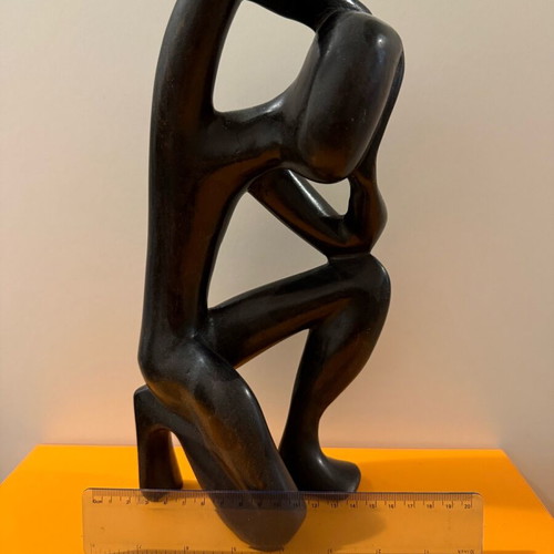 African figure of a thinking man used, solid wood