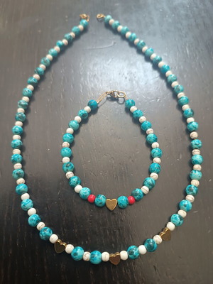 Handmade beaded necklace with gold heart detail