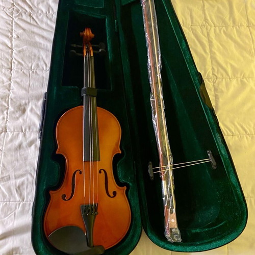 Wooden violin used for beginners with bow and case