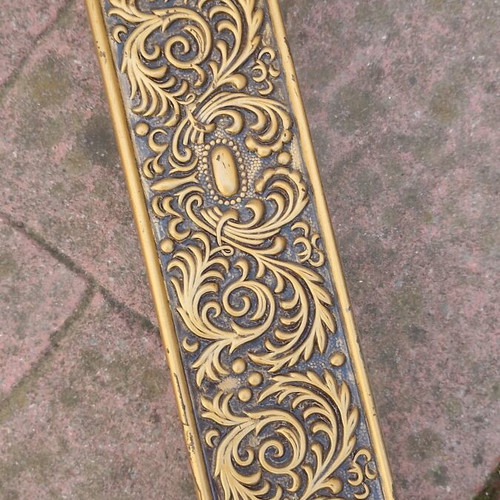 Metallic vintage curtain rail with brass coloured details used