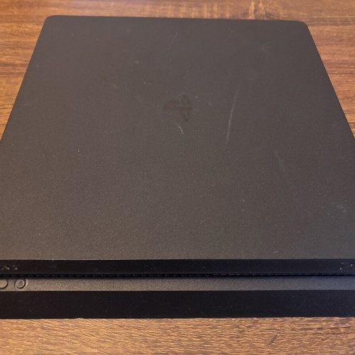 Sony PlayStation 4 Slim 500GB console with controllers