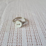 Handmade ring with metal wire and white plastic button
