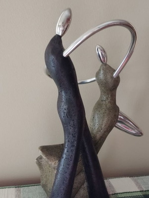 Sculpture two dancers used with ceramic and metal elements