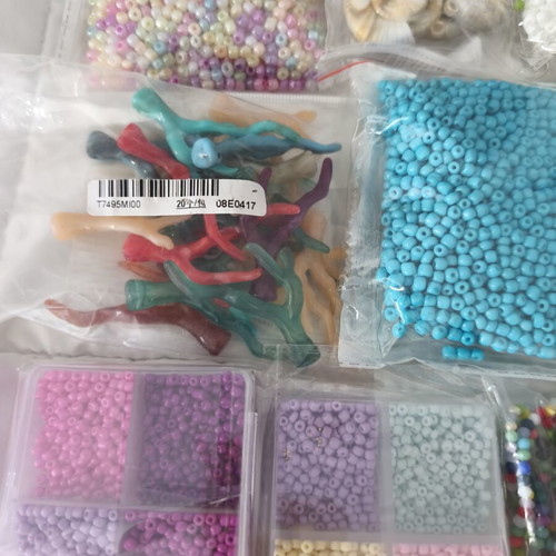 Jewelry making materials like new, shell chips, plastic and resin beads