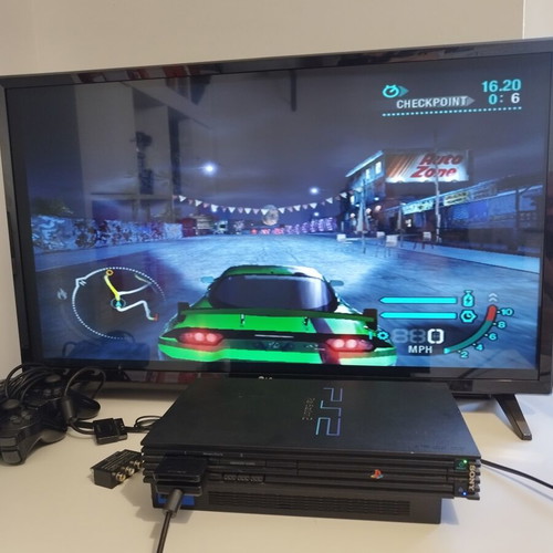 PlayStation 2 Fat console used with 2 controllers, memory card and 21 games