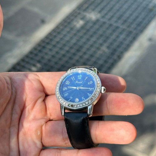 Vintage Pearl wristwatch with blue dial and stones