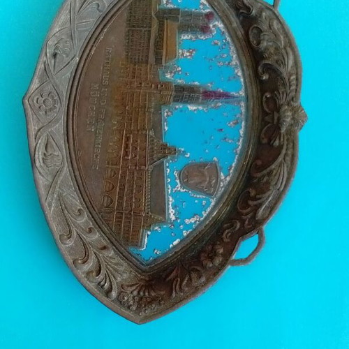 Metal wall plate used with embossed designs and old Munich town hall