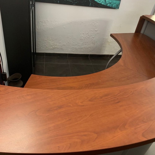 Reception desk used with metal perforated front panel