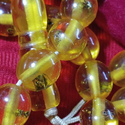 Worry beads with insects inside beads, unknown material