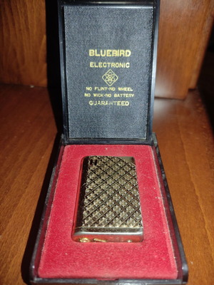 Bluebird lighter used, collectible, gold color