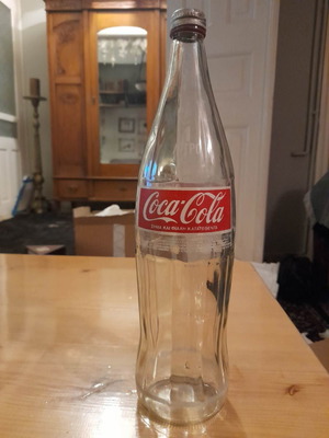 1 συλλεκτικό μπουκάλι Coca-Cola 1039 γρ. 1990 με το καπάκι του