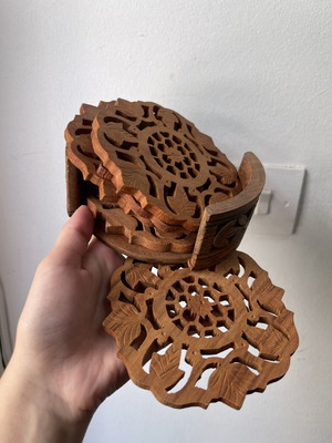 Vintage wooden coaster set 6 pieces with carved design and holder