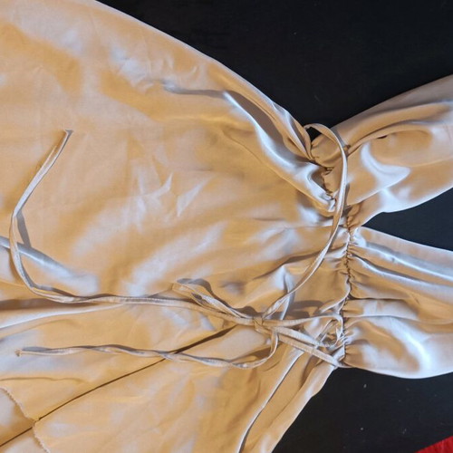One-piece mini romper like new, gold with crisscross back