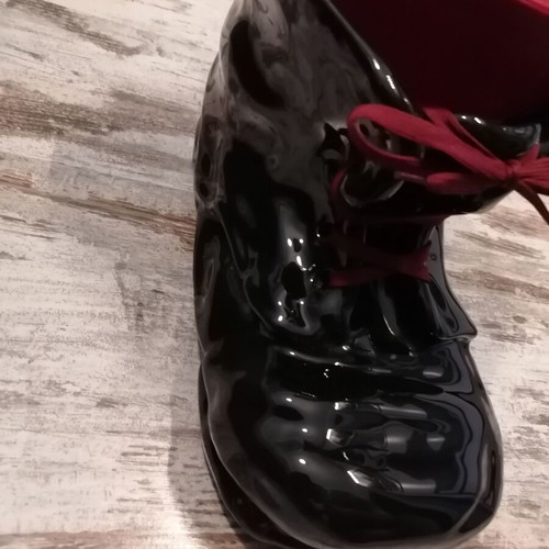 Vintage black boot-shaped planter like new