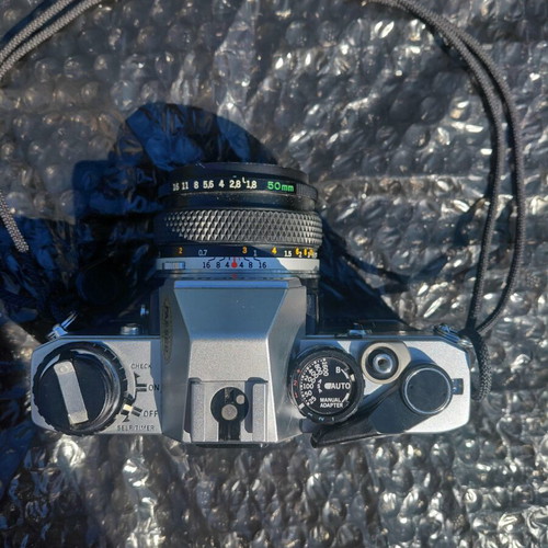 Olympus OM-10 film camera with Zuiko 50mm f/1.8 lens