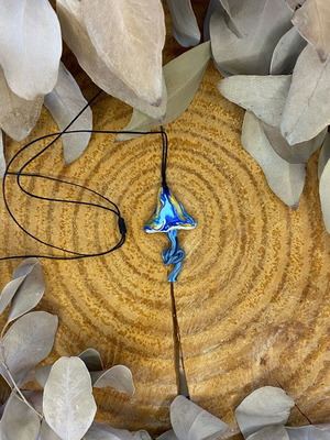 Handmade polymer clay mushroom necklace on waxed cord