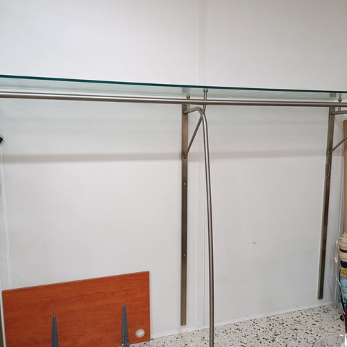 Stand with glass wall-mounted shelf used