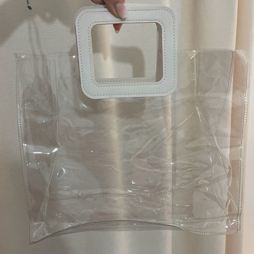Transparent women handbag like new with white handle