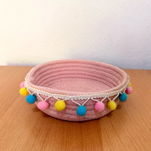 Handmade pink basket with colorful pom poms like new