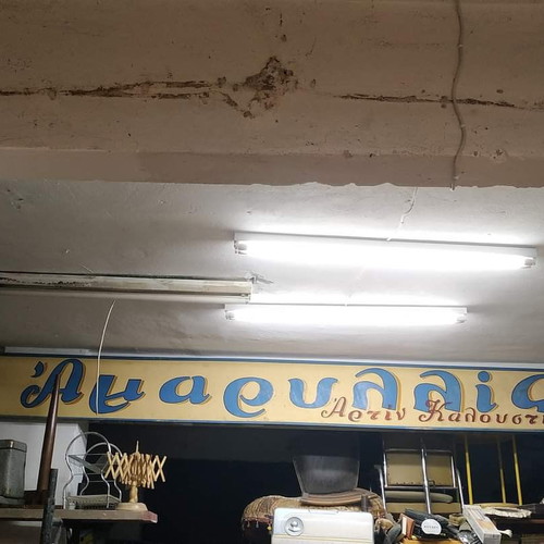 Old wooden sign used from tailoring shop