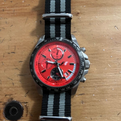 Jacques Lemans F1 watch with red dial