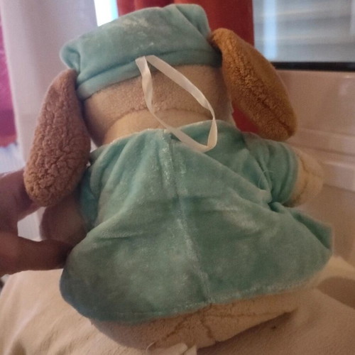 Stuffed animal dog in pajamas used with small seam opening