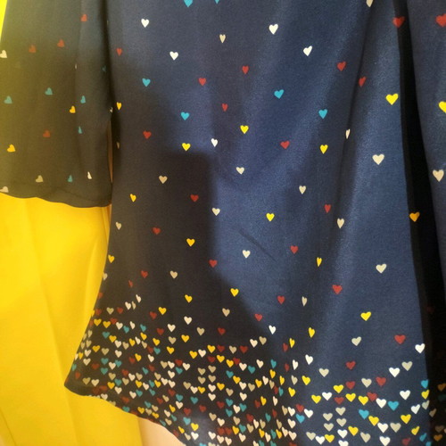 Office pants and top with hearts used, yellow and blue