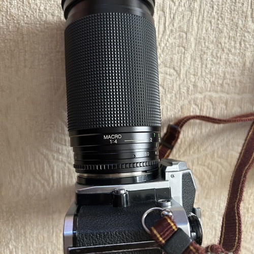Nikon FM2 35 mm camera used with Telezon telephoto lens and lens cap