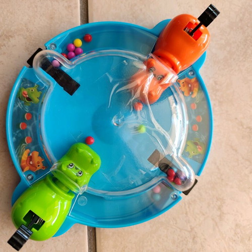 Food grabbing game with hippos like new
