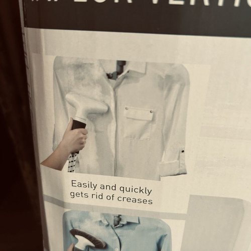 Vertical garment steamer with hanger and accessories
